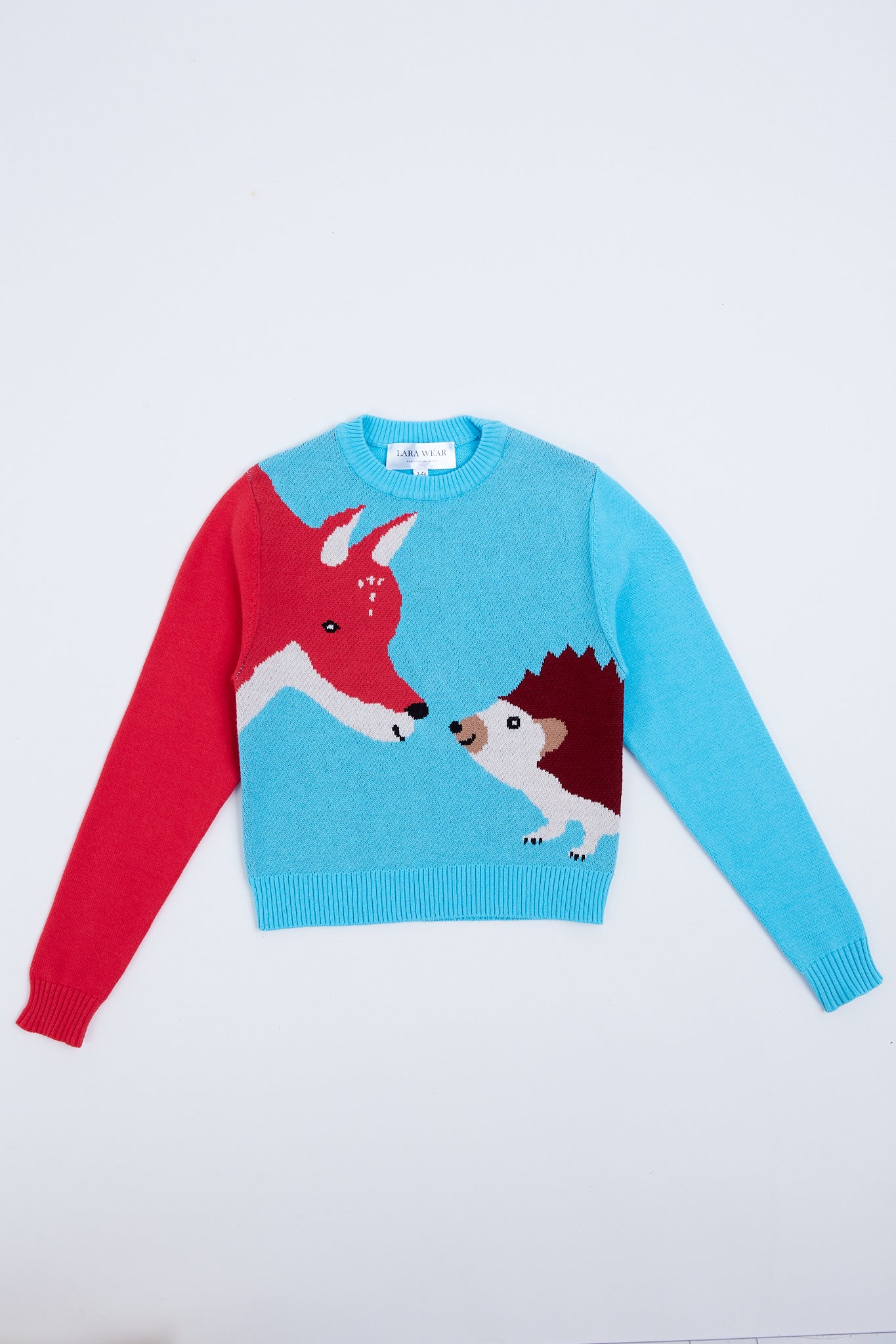 Playful children's sweater with fox and hedgehog